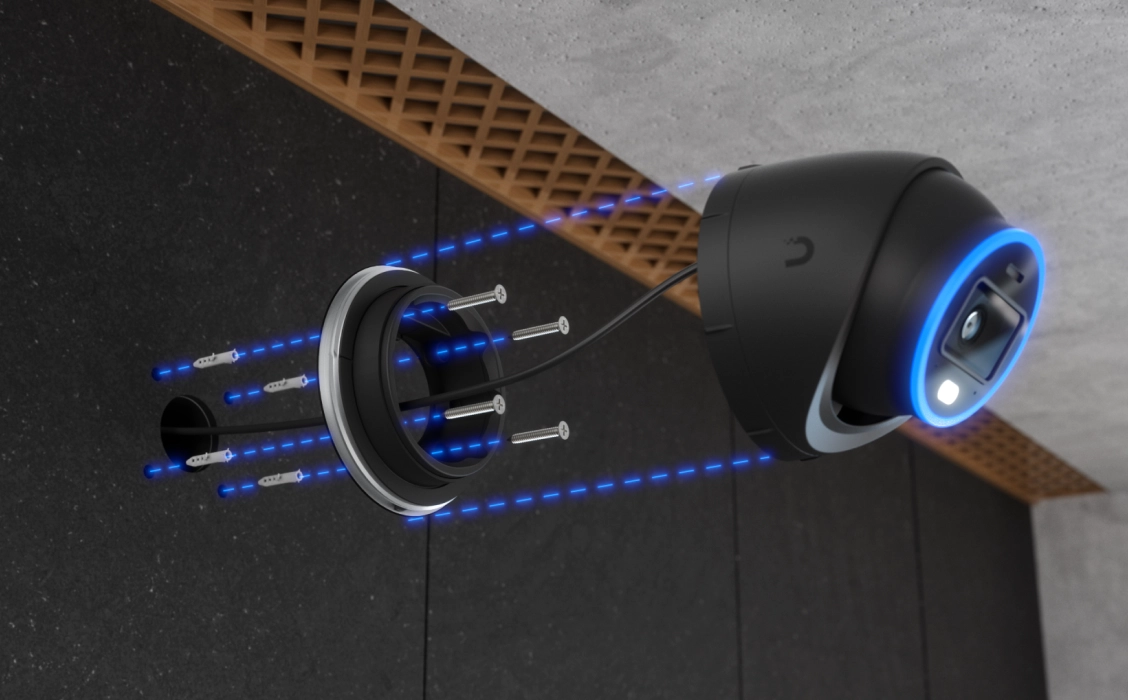 Diagram instalacji kamery Ubiquiti UVC-AI-Turret pokazujący mocowanie na ścianie za pomocą śrub